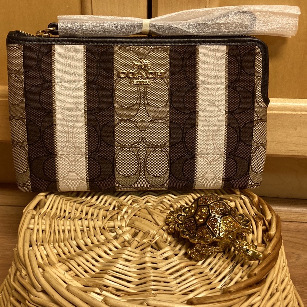 Coach large Jacquard wristlet w/stripes. Gold/khaki black multi.